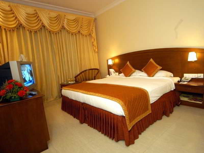 Aj International Hotel Bangalore Værelse billede